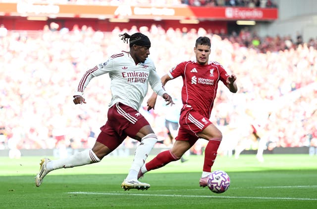 <p>Milos Kerkez (right) running with Arsenal’s Noni Madueke</p>