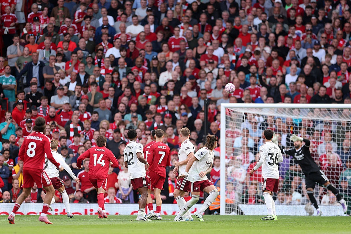Arsenal goalkeeper David Raya points to new Puma ball after conceding long-range free-kick at Liverpool