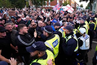 The demonstrators protested a police minibus after being detained by a protester police