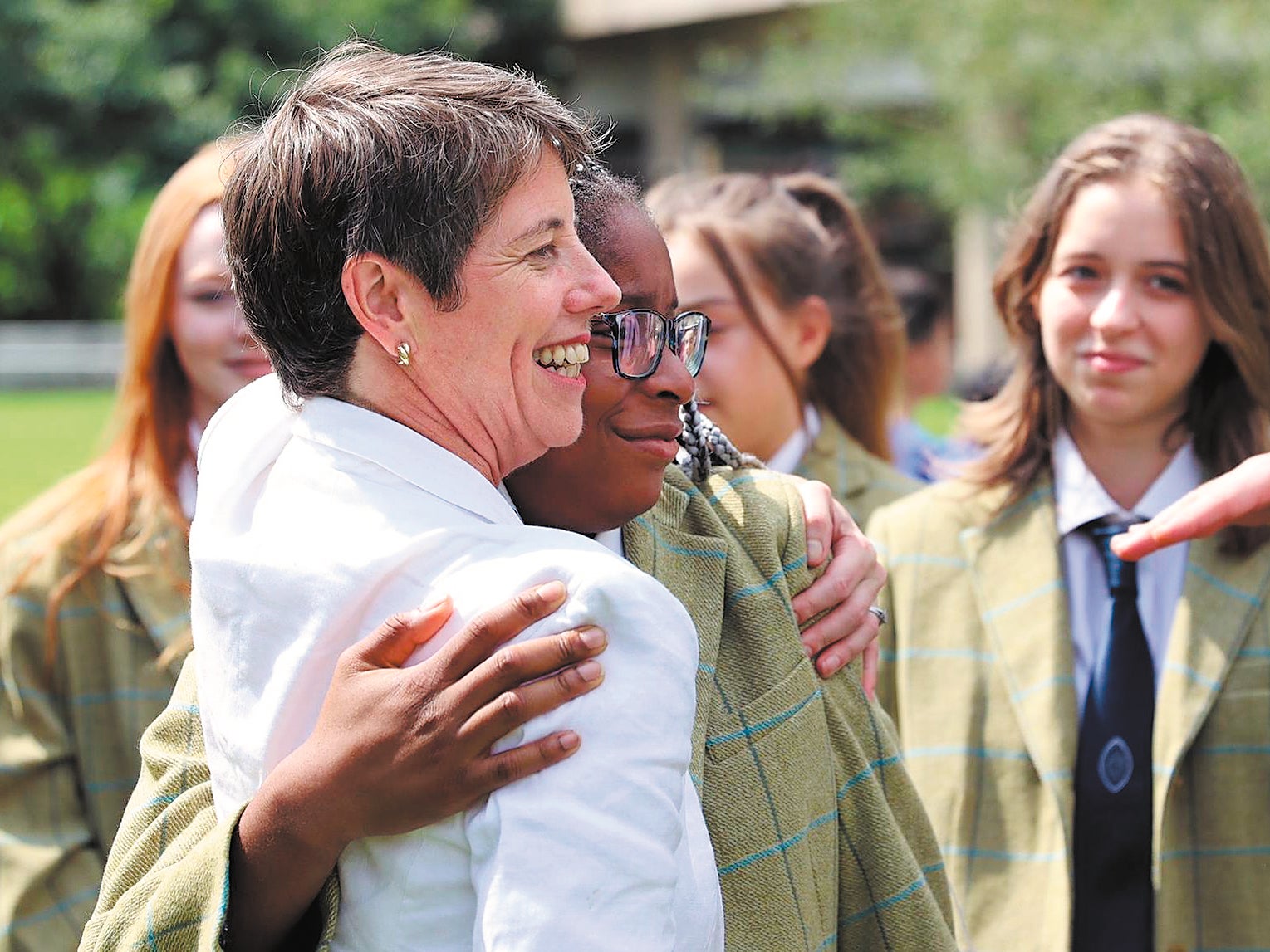 A scholarship winner hugs H-J Colston-Inge, director of Engage with China (left) in Changzhou during the 2023-24 academic year