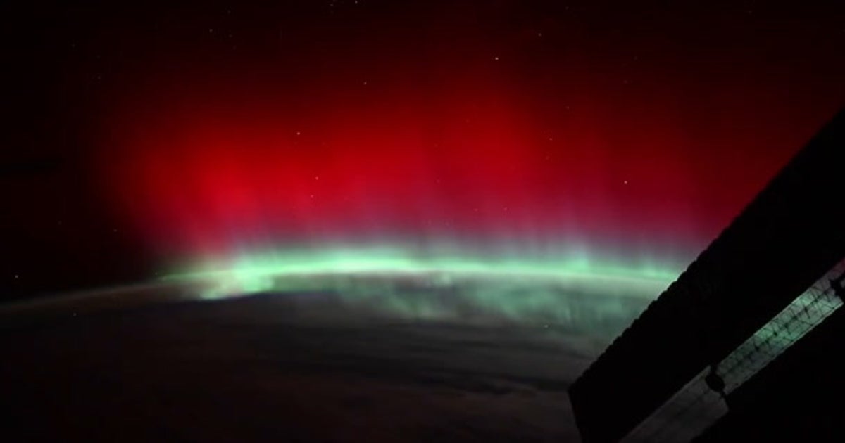 Rare red aurora glows above Earth in extraordinary space video