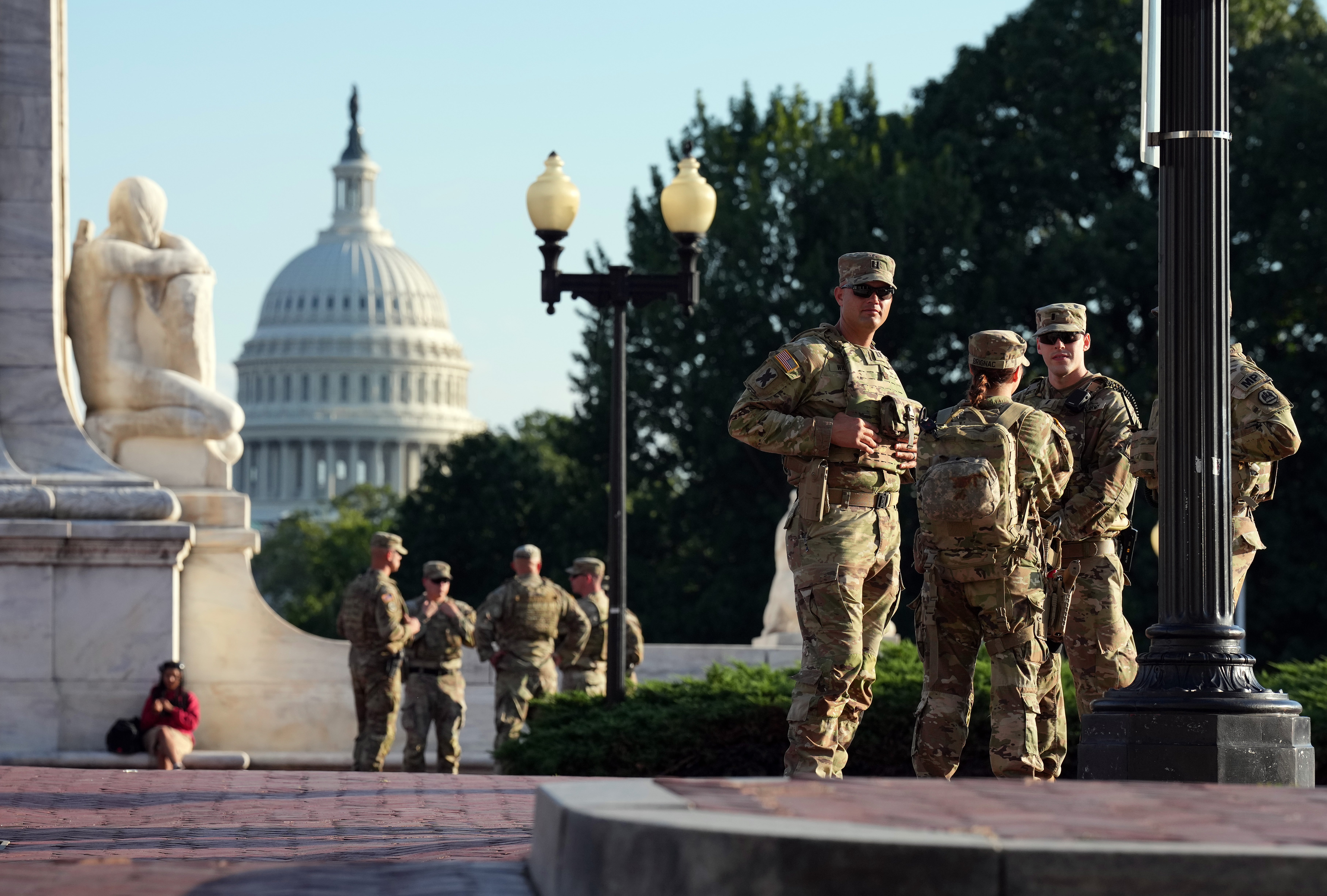 Members of the National Guard armed with sidearms patrol Union Station on August 25, 2025