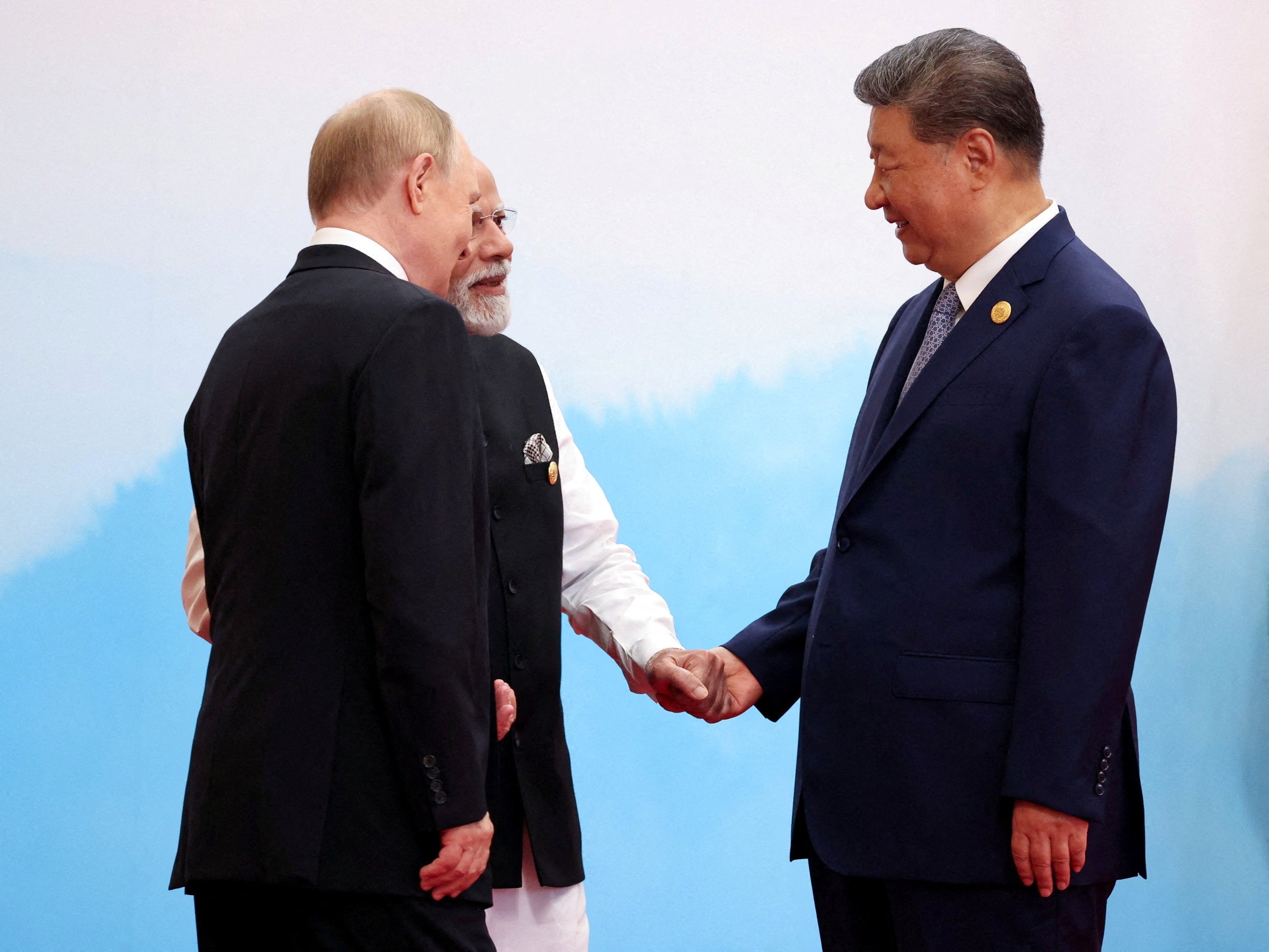 Chinese President Xi Jinping, Indian Prime Minister Narendra Modi and Russian President Vladimir Putin speak during a meeting at the Shanghai Cooperation Organisation (SCO) summit in Tianjin, China#