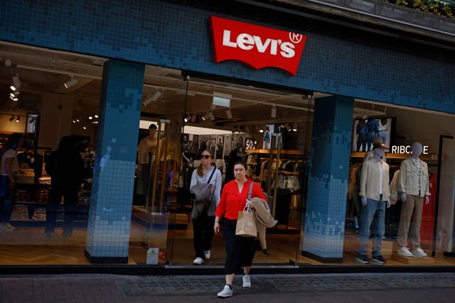 <p>Shoppers exit a Levi's store in central London on April 4 2025</p>
