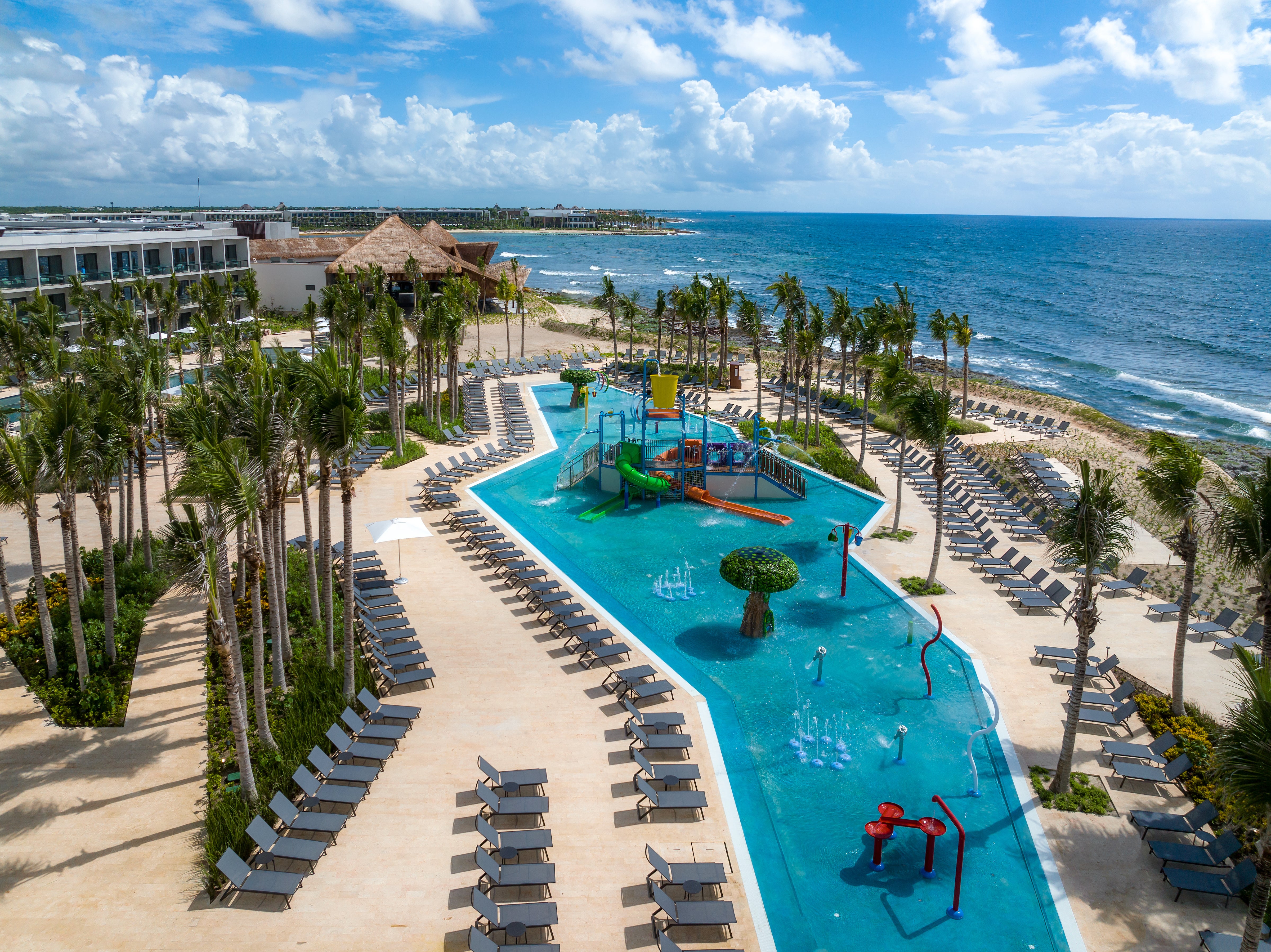 Lounge amid the palms and by one of the eight pools at the stunning Hilton Tulum Riviera Maya All-Inclusive Resort
