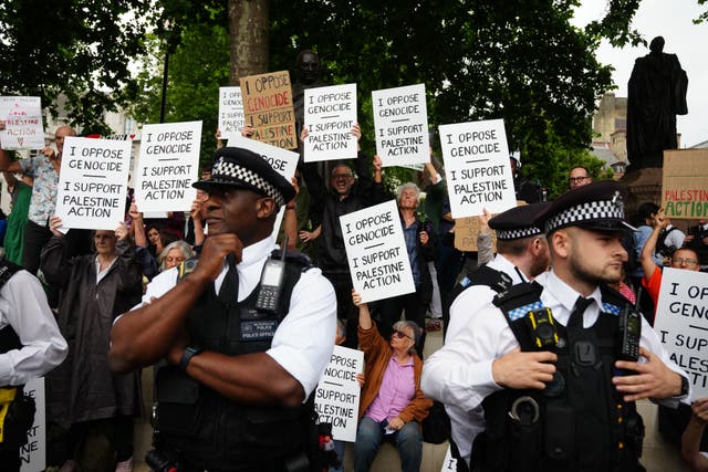 An earlier protest in central London in support of Palestine Action was organised by the Defend Our Juries group (Jeff Moore/PA)