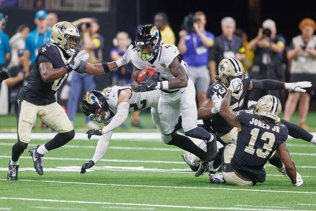 <p>Jacksonville Jaguars running back Tank Bigsby (4) returns a kickoff as he tries to get past New Orleans Saints safety Ugo Amadi (0) </p>