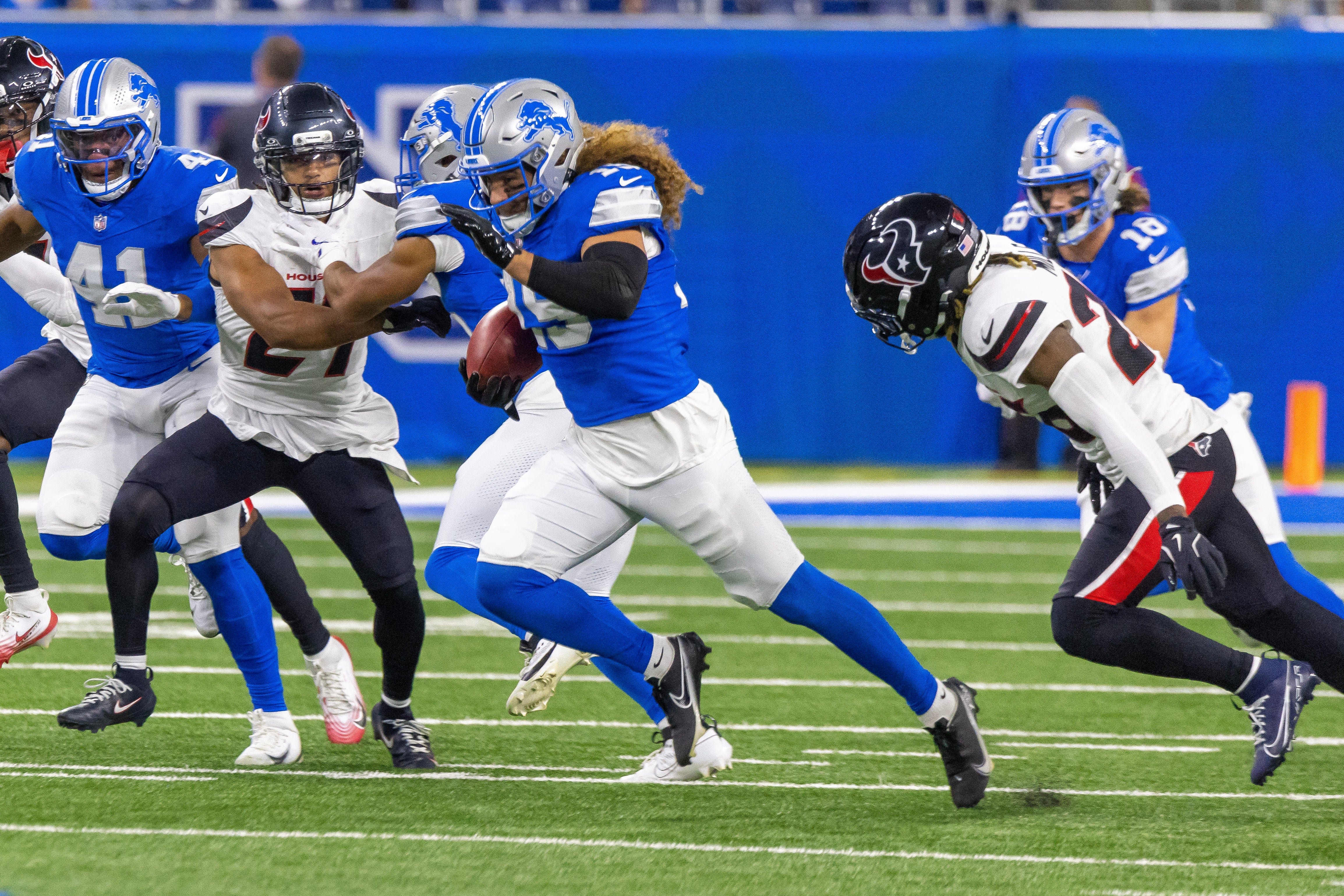 Detroit Lions linebacker Grant Stuard (15) runs with the ball after the opening kickoff against the Houston Texans