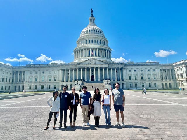 <p>Interns and intern coordinators in the US Attorney's Office for DC posed outside the US Capitol but identified the building as the Supreme Court</p>