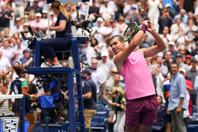 <p>Carlos Alcaraz celebrates with a golf swing (Kirsty Wigglesworth/AP)</p>