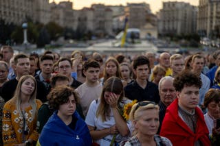 People attend a memorial service