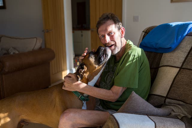 <p>David Scott, pictured with his Boxer dog Will, was diagnosed in early 2024 </p>
