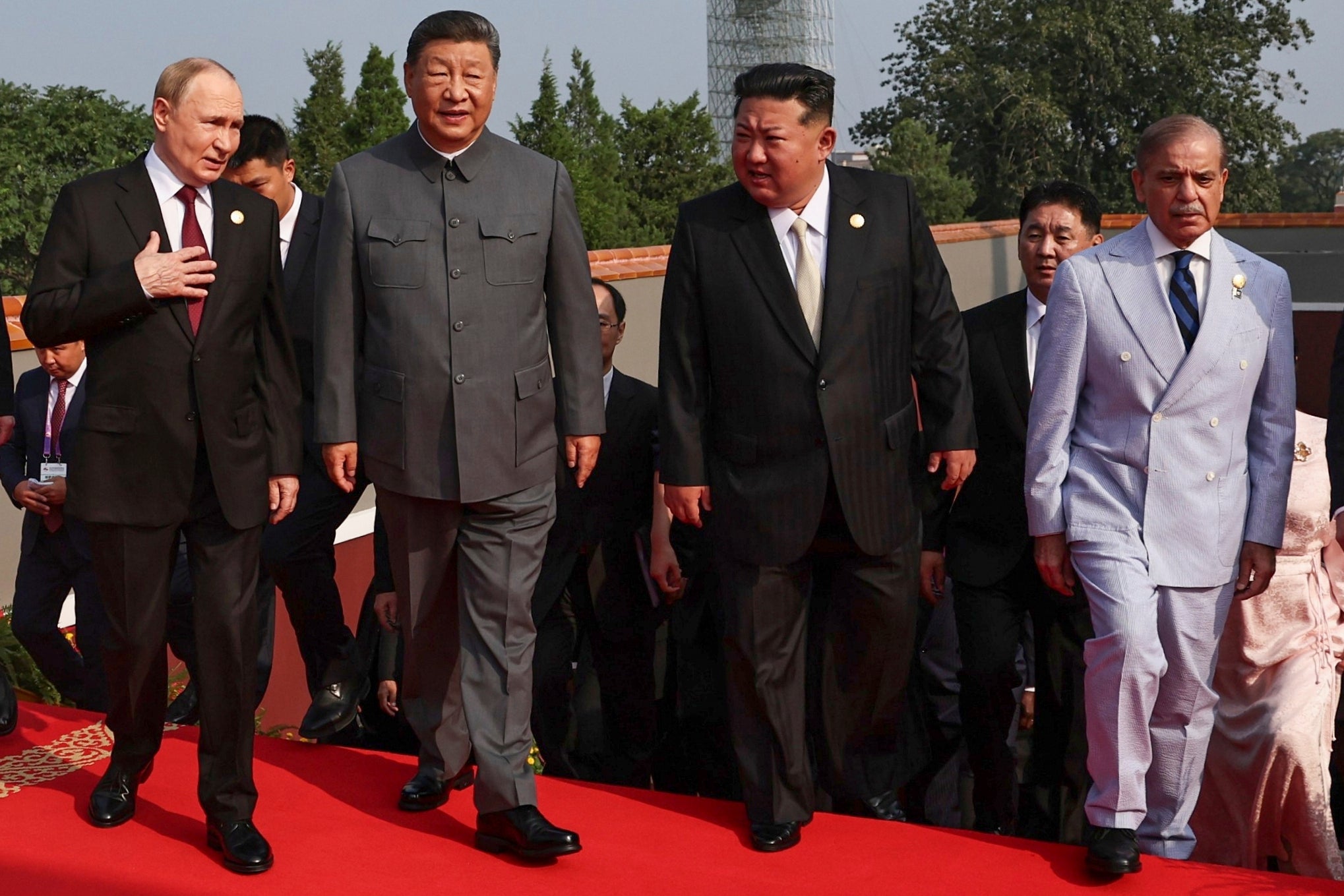 Xi Jinping is flanked by Vladimir Putin and Kim Jong Un, North Korea’s ruler, who beamed at the sight of China’s biggest ever military parade in Tiananmen Square