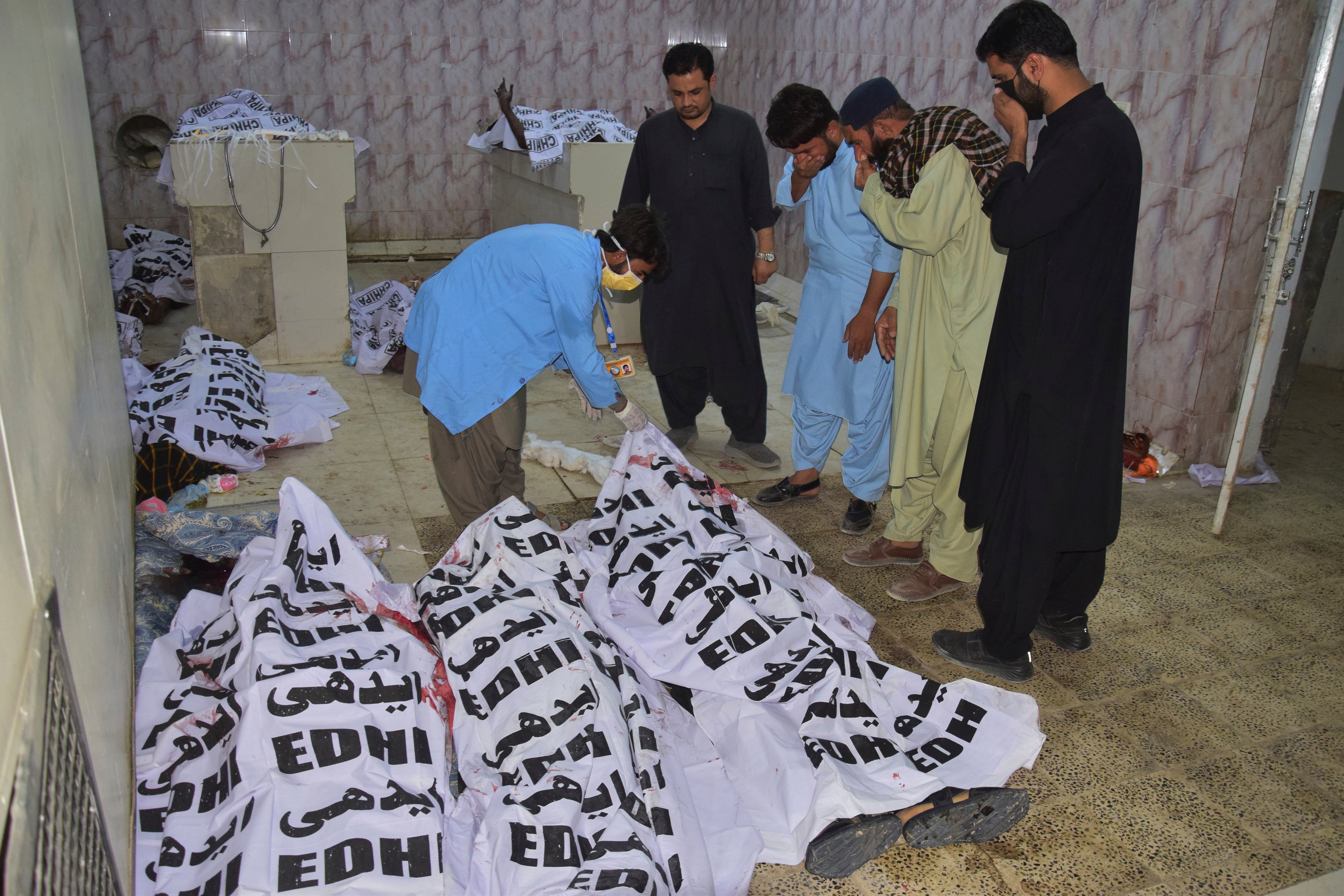 <p>People identify bodies of the victims of a suicide bombing in a hospital morgue in Quetta, Pakistan, on 2 September 2025</p>