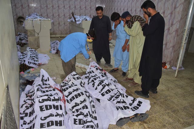 <p>People identify bodies of the victims of a suicide bombing in a hospital morgue in Quetta, Pakistan, on 2 September 2025</p>
