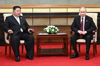 Russian president Vladimir Putin (2nd-R) and North Korean leader Kim Jong Un (2nd-L) meet after attending a military parade marking the 80th anniversary of victory over Japan and the end of World War II