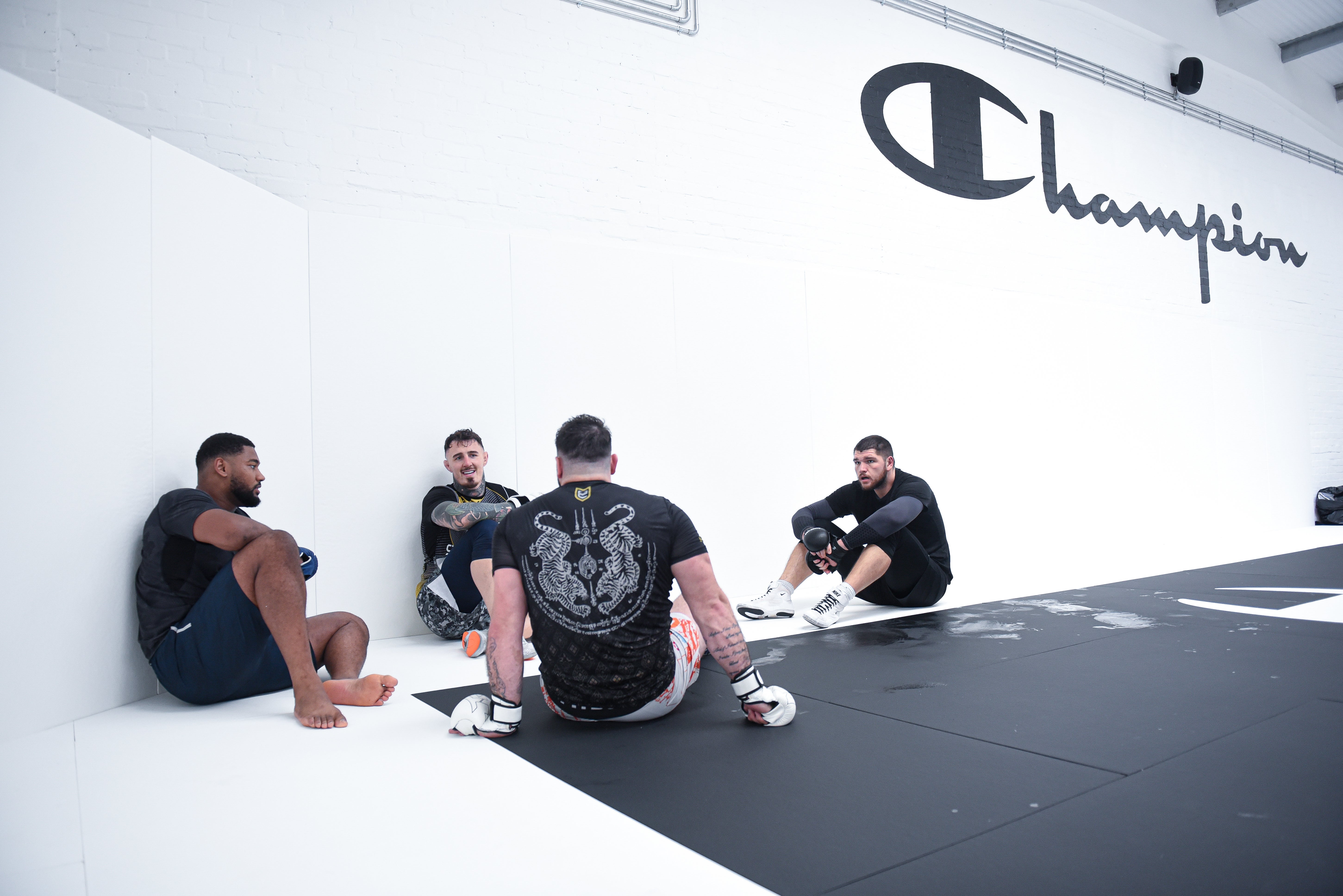 Pinto with UFC heavyweight champion Tom Aspinall (second-left) and training partners