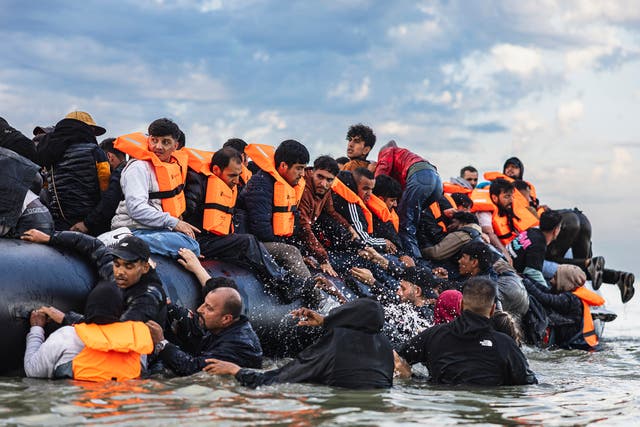 <p>Migrants on a boat in the Channel on Thursday</p>