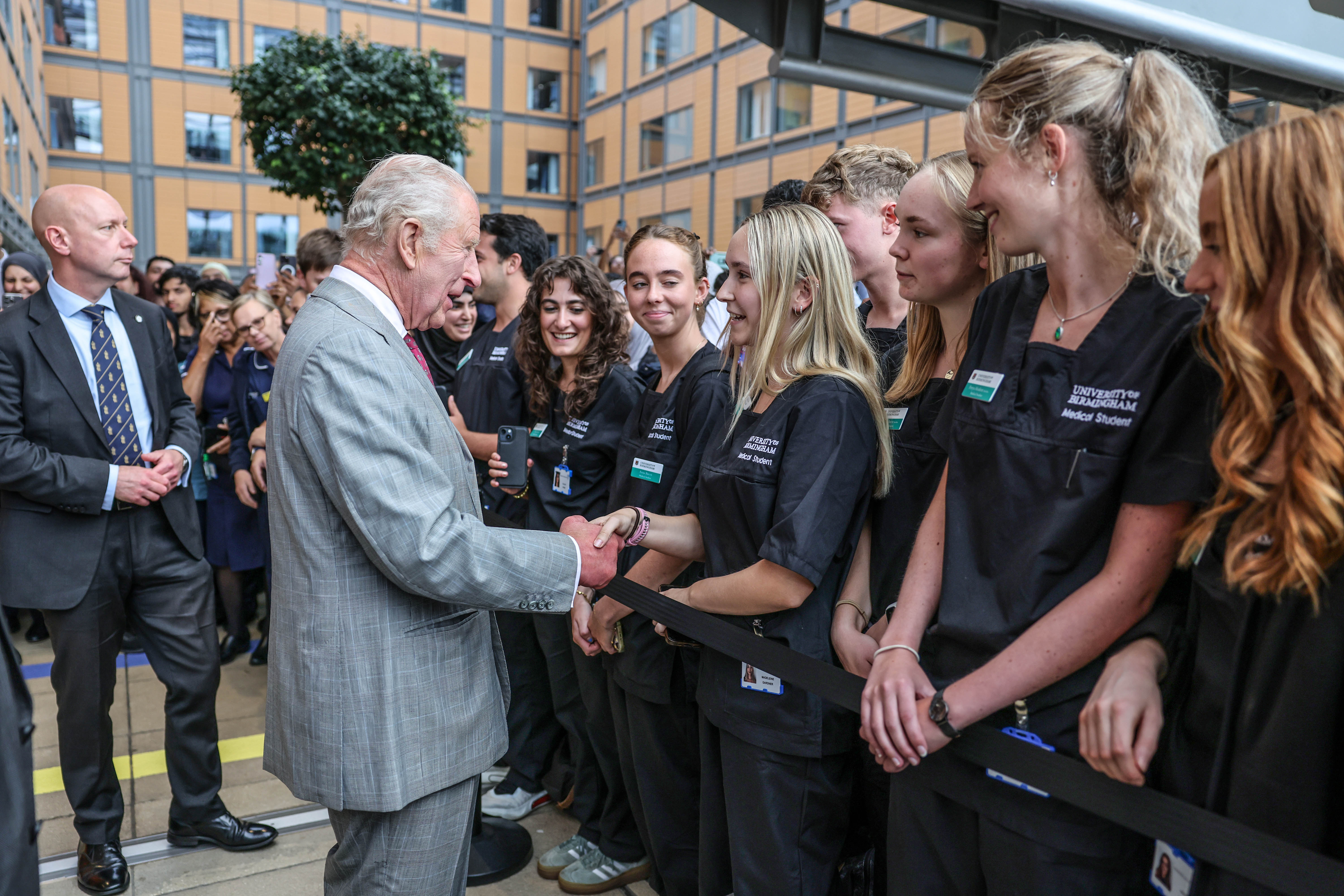 <p>King Charles III is greeted by medical students  during his visit to officially open the new Midland Metropolitan University Hospital in Birmingham</p>