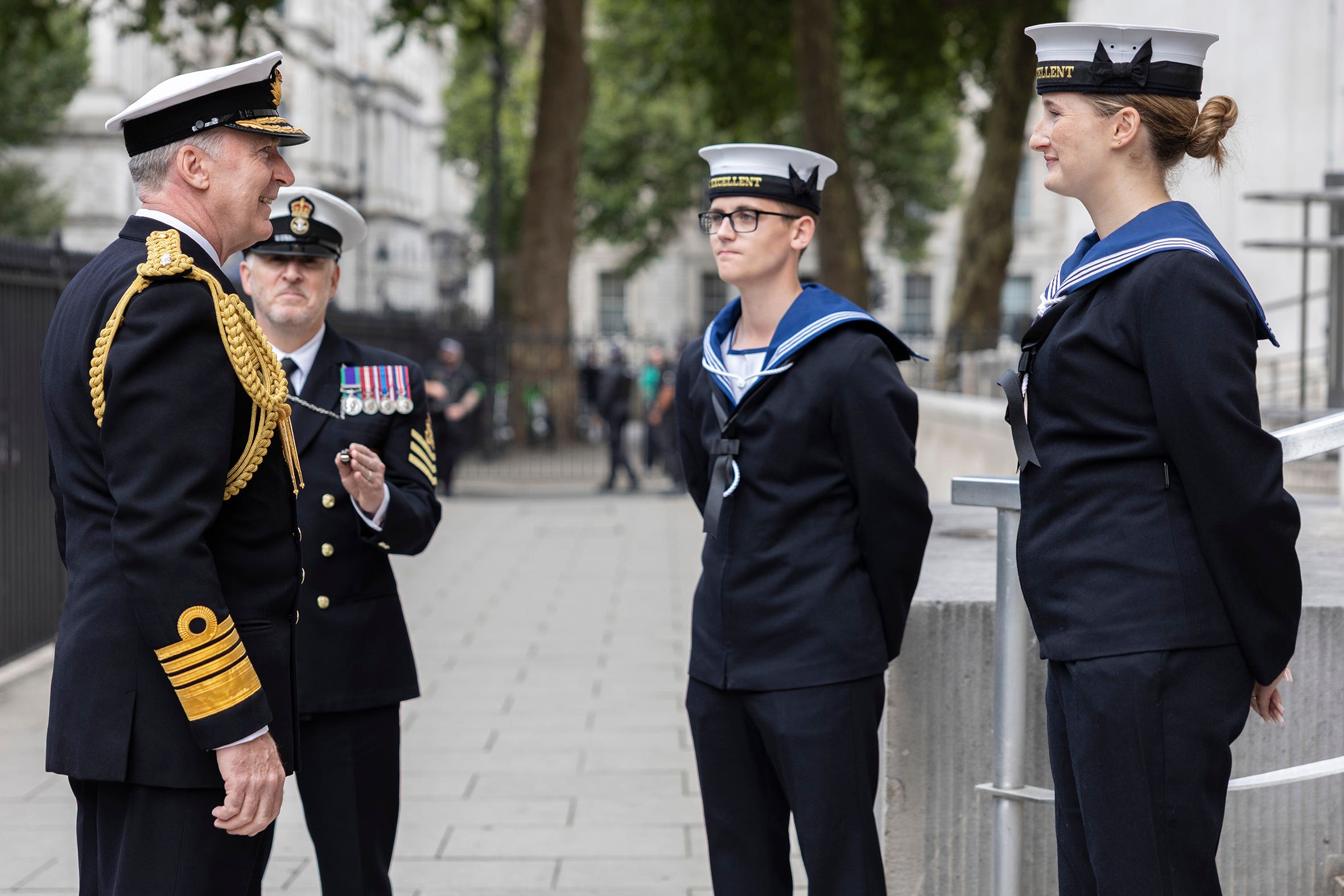 Admiral Sir Tony Radakin outside the Ministry of Defence headquarters talking with military personnel at the end of his service as chief of defence staff (Royal Navy/PA)