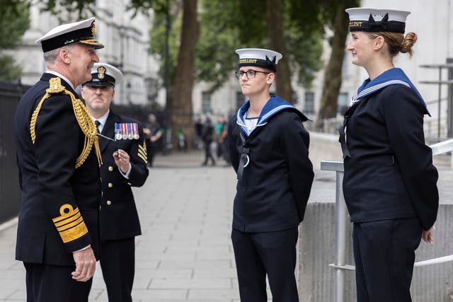 Admiral Sir Tony Radakin outside the Ministry of Defence headquarters talking with military personnel at the end of his service as chief of defence staff (Royal Navy/PA)