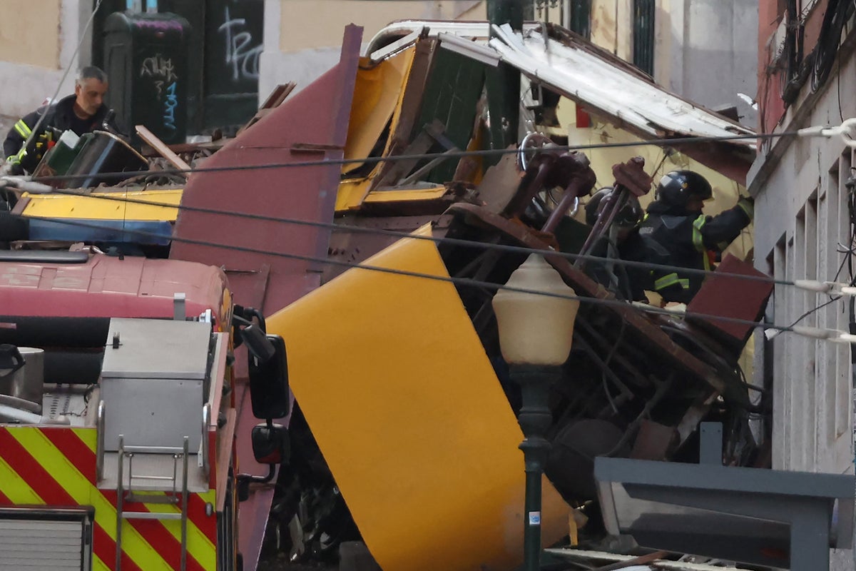 Lisbon funicular crash latest: At least 16 killed in cable car derailment as tourists from 10 countries injured
