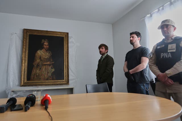 <p>Giuseppe Ghislandi's 18th-century painting ‘Portrait of a Lady’, reportedly stolen by a Nazi officer during World War II and discovered in the home of his daughter after appearing in a real estate listing, is displayed during a press conference by Prosecutor Daniel Adler in Mar del Plata, Argentina, 3 September 2025 (AP Photo/Christian Heit)</p>