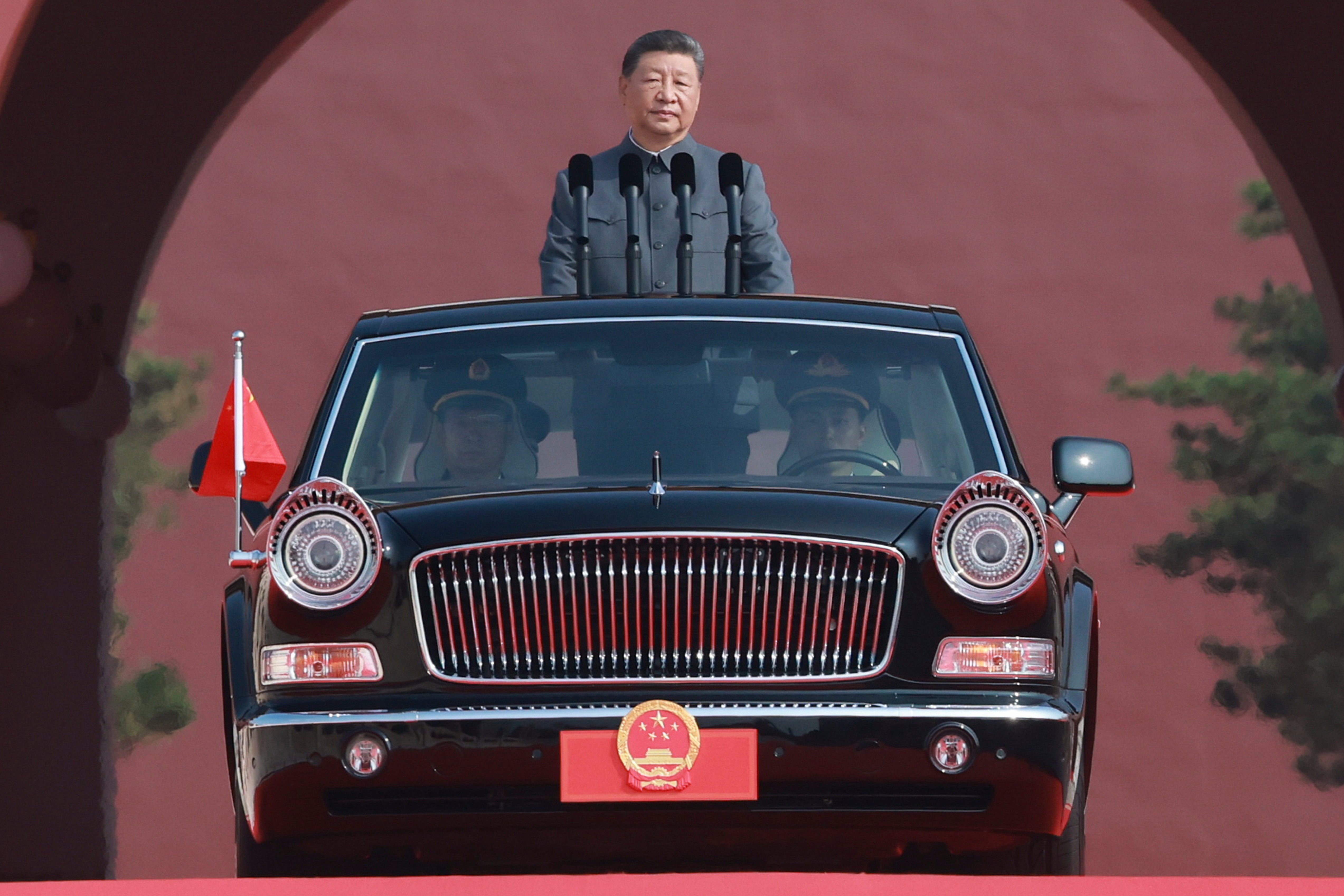 Chinese president Xi Jinping is ready to review troops as a Hongqi limousine carrying him