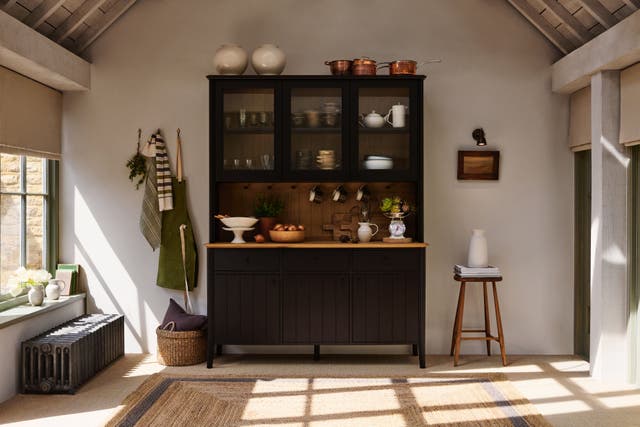 Earthy browns, leather and dark timber décor are making their mark (John Lewis/PA)
