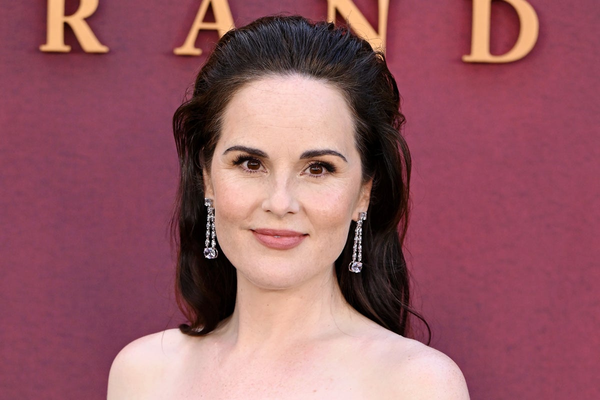 Downton Abbey star Michelle Dockery reveals she&rsquo;s pregnant with first child at new film&rsquo;s premiere 