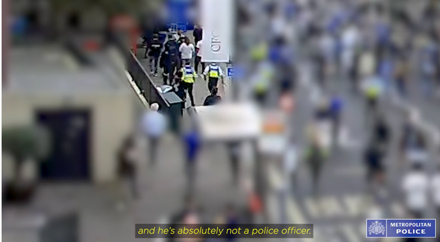 <p>The man walks through the crowd </p>