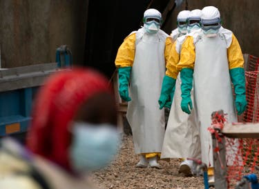 <p> Health workers dressed in protective gear begin their shift at an Ebola treatment centre in Beni, DRC</p>