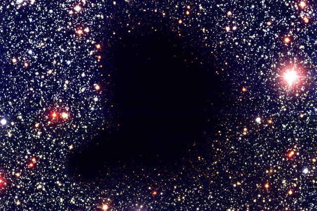 <p>The dark interstellar cloud Barnard 68 resembles a 'hole in the heavens'</p>