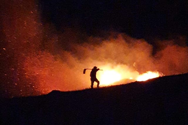 Gamekeeper tackling a wildfire (Scottish Gamekeepers Association/PA)