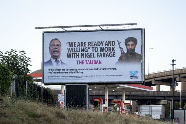 Billboard installed outside the Reform UK party convention in Birmingham on Friday (Rowan Farrell/Freedom from Torture/PA)
