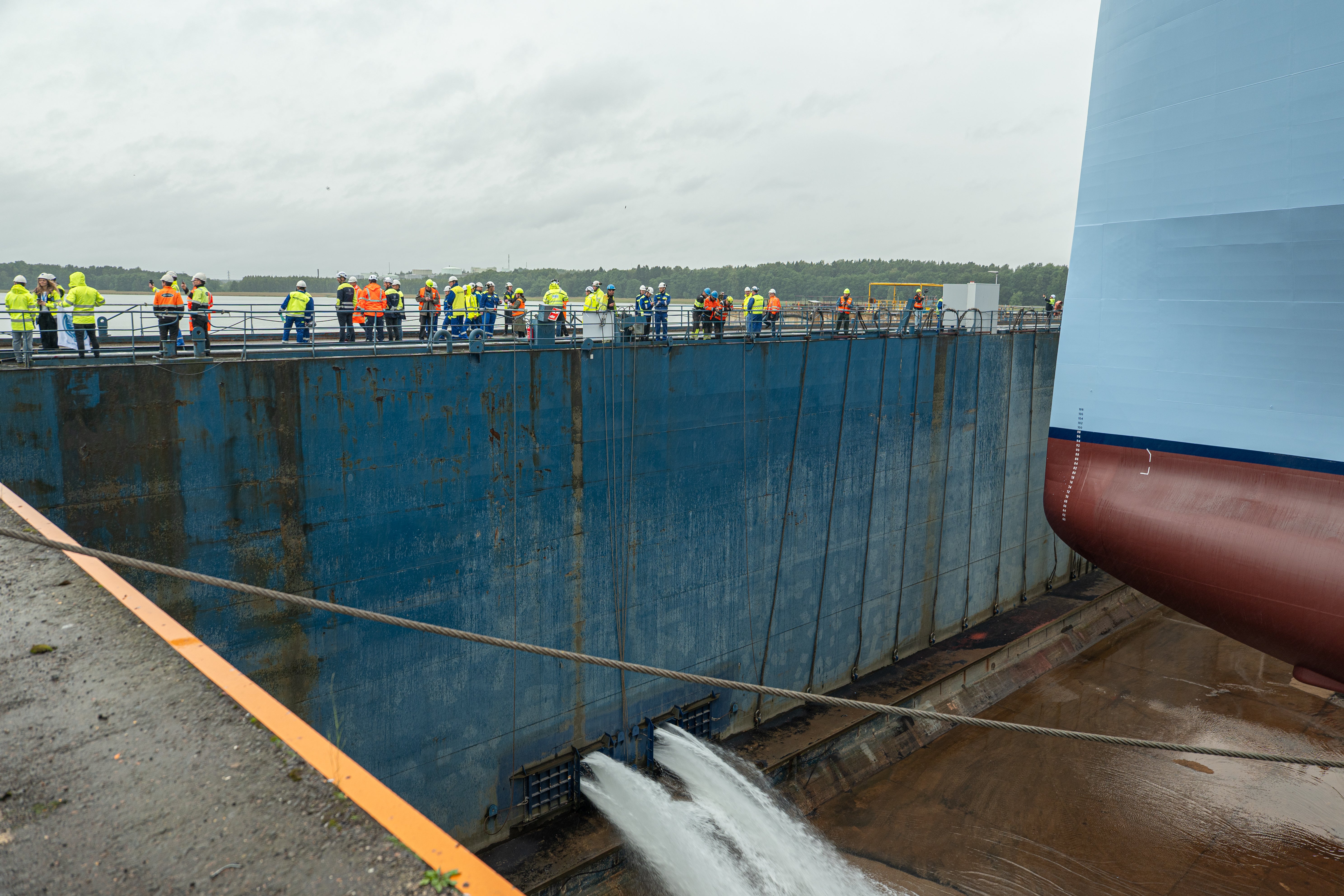 Water fills the Meyer Turku dockyard to prepare Legend of the Seas for its float-out ceremony