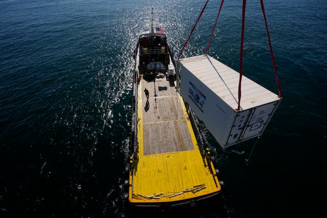 <p>A supply container is lifted from the Gaspee, a crew transport vessel, to the Liftboat Robert platform during an Expedition 501 crew and supply transfer in the North Atlantic, Saturday, July 19, 2025. (AP Photo/Carolyn Kaster)</p>