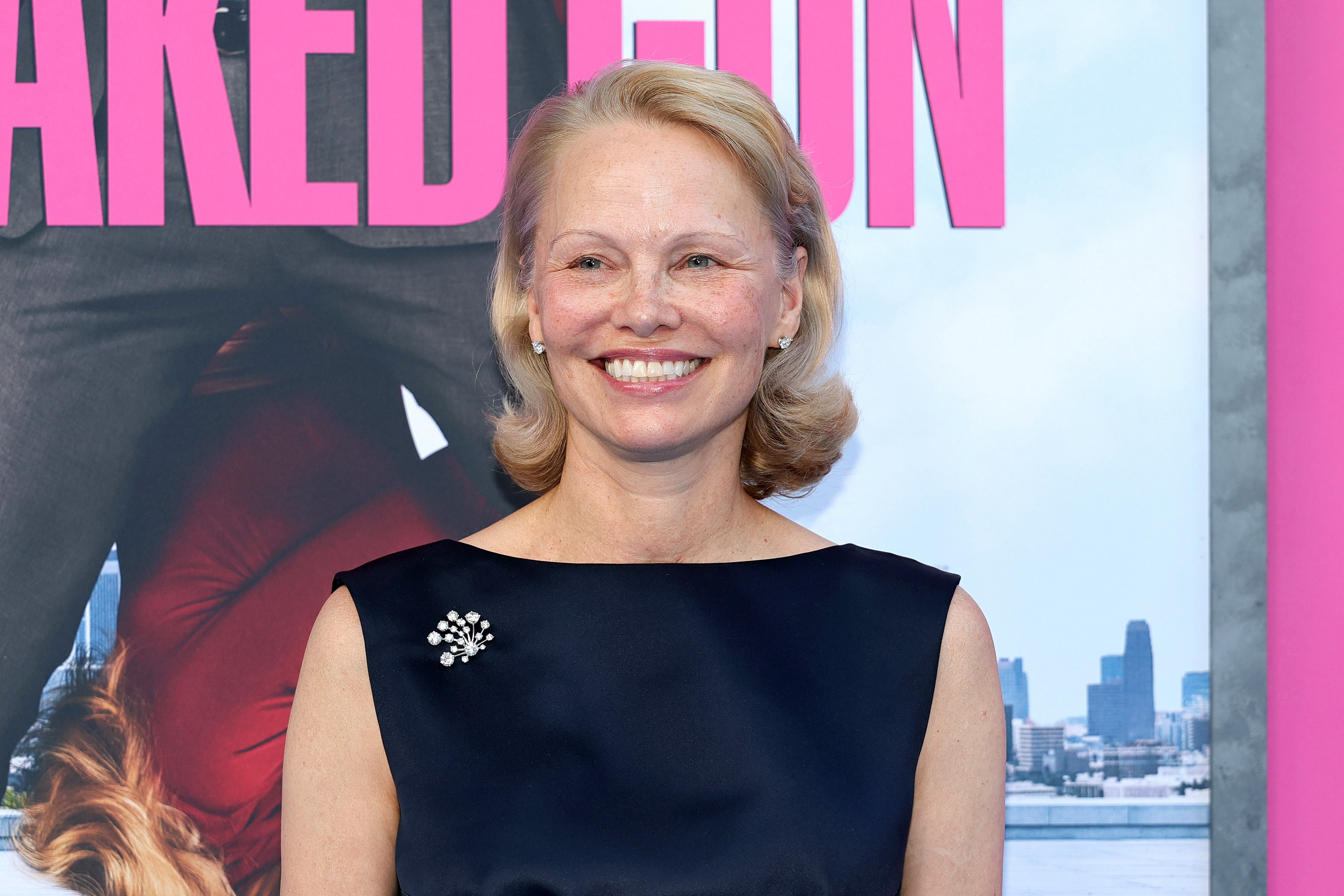 A bare-faced Pamela Anderson attending a premiere in June