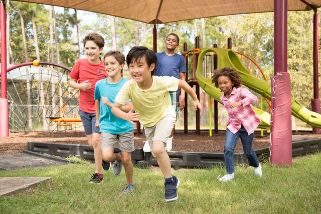 <p>Children at a school playground (stock image). Researchers at Northwestern say having high blood pressure by age seven increases the risk for death from cardiovascular disease </p>