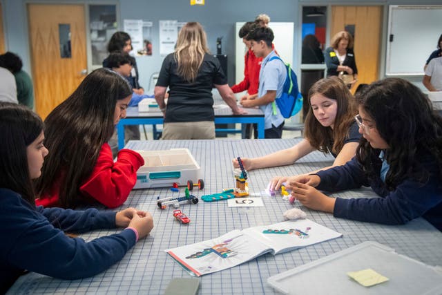 <p>Students work on a project during a LEGO Education science lesson at Lorenzo De Zavala Middle School, Texas </p>