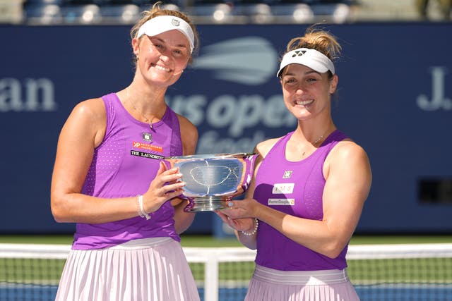 Gabriela Dabrowski, right, and Erin Routliffe hold the US Open trophy (Frank Franklin II/AP)