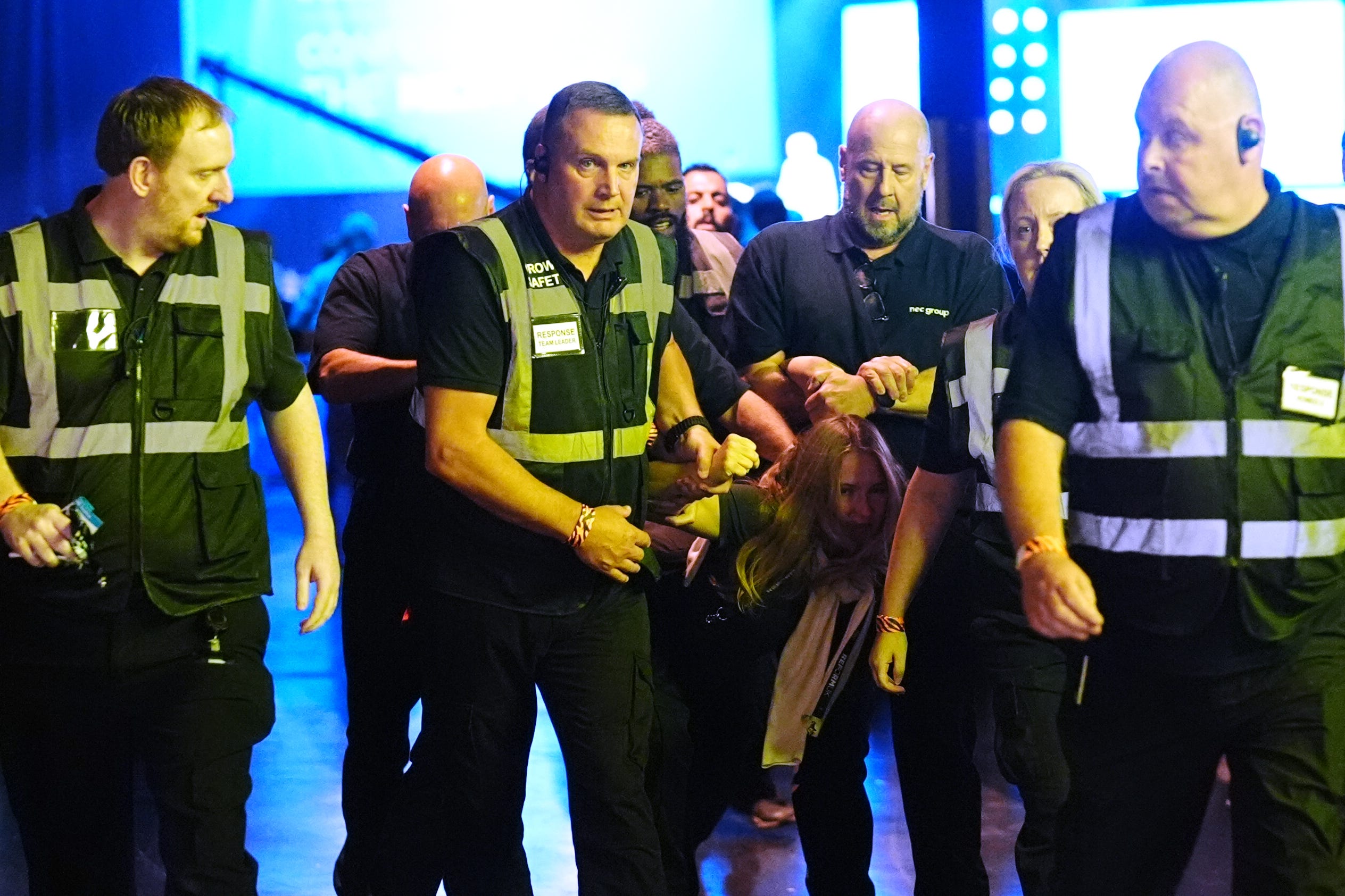 A protester is removed from an address by Reform UK leader Nigel Farage during the party’s annual conference (Jacob King/PA)