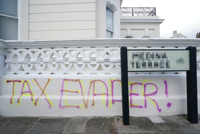 Graffiti outside the apartment building in Hove, East Sussex (Gareth Fuller/PA)