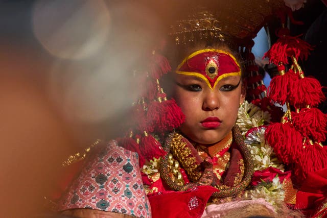 <p>Living goddess Kumari is seen sitting inside the chariot during Indra Jatra, a festival that marks the end of the rainy season in Kathmandu, Nepal</p>
