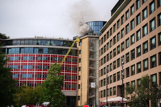 Firefighters battling a blaze at the Helios Building at Television Centre (James Manning/PA)