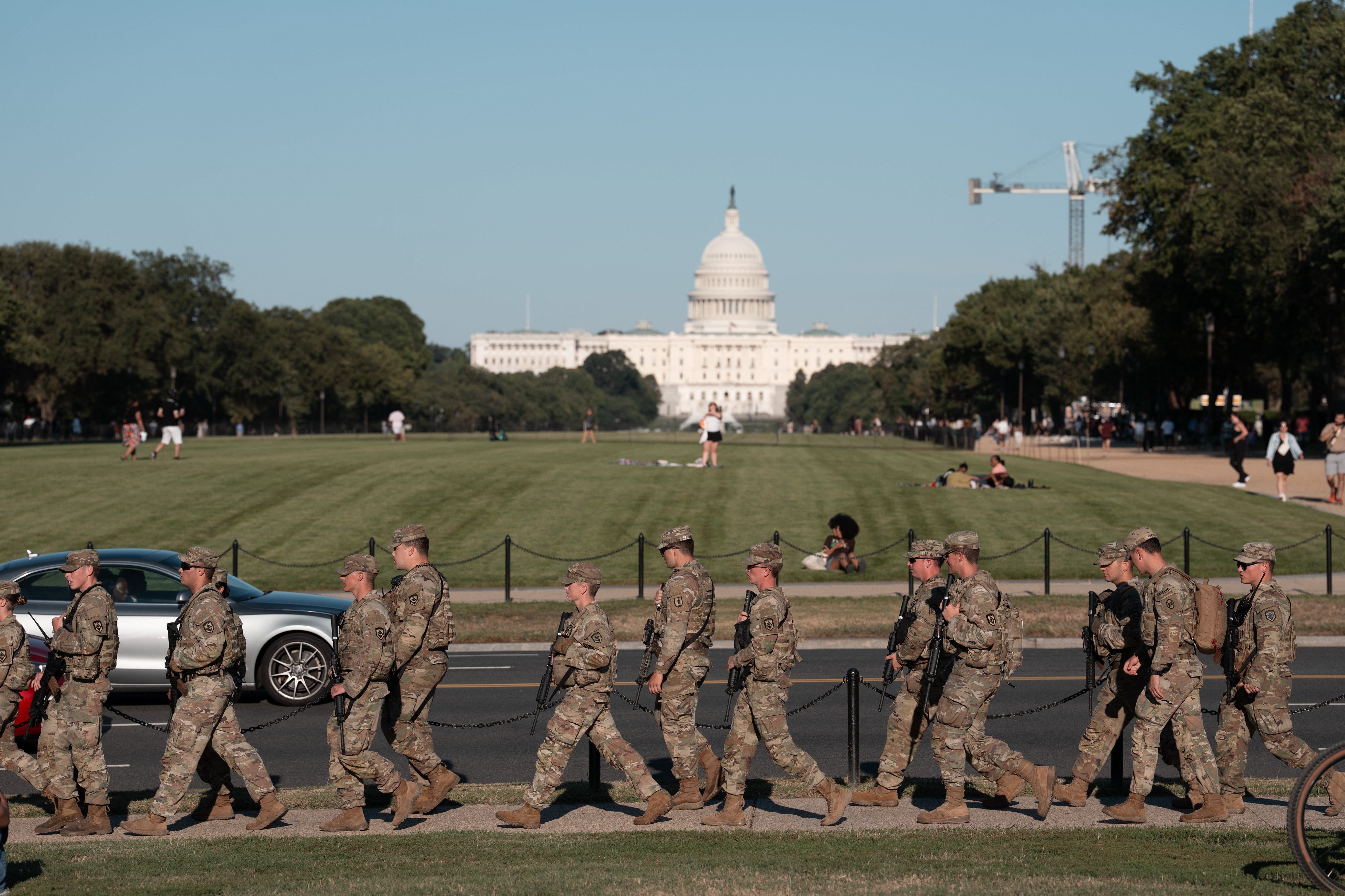 President Donald Trump has threatened Democratic-run cities with the prospect of deploying the National Guard to help control crime and assist in immigration raids