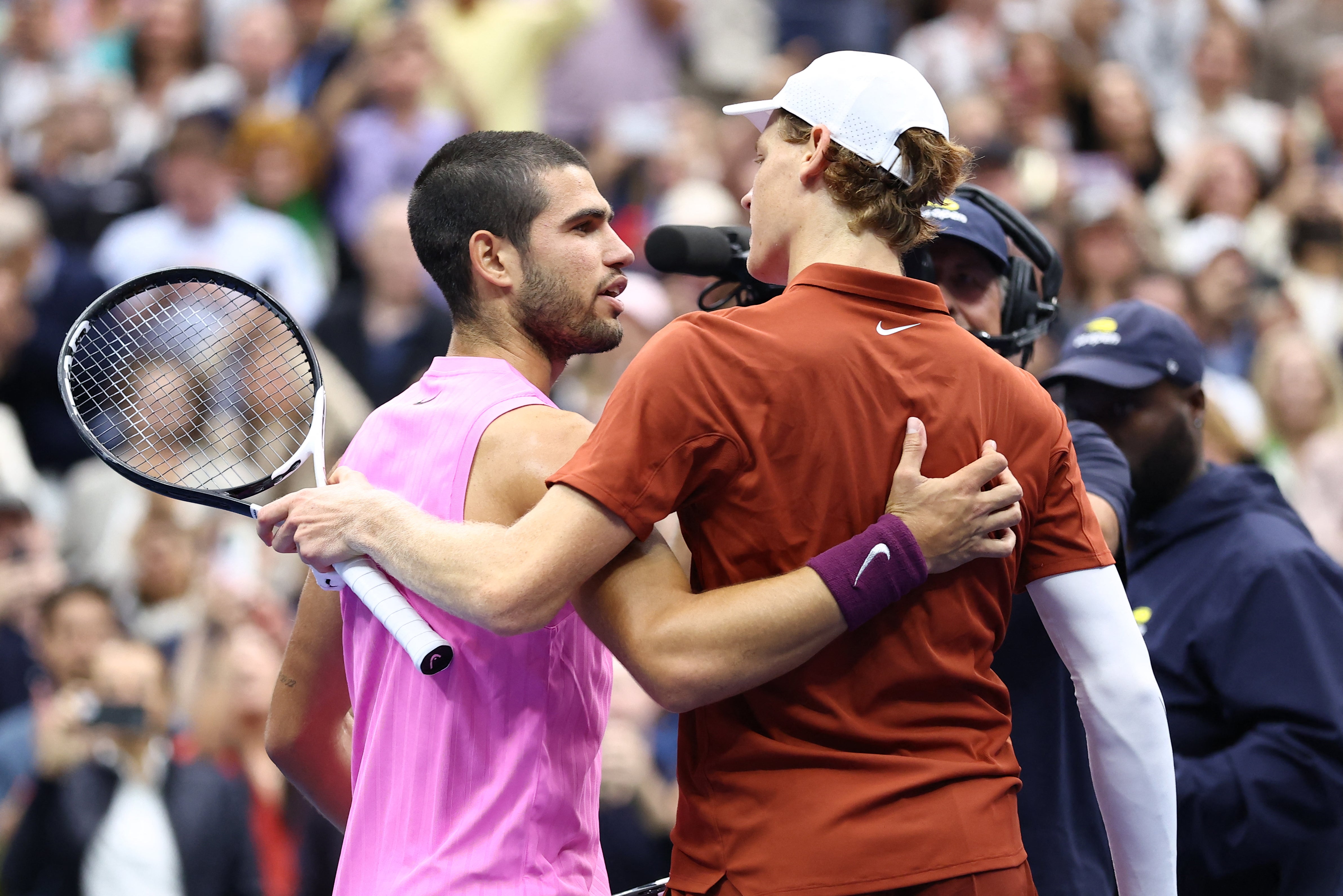 Alcaraz and Sinner meet at the net after a third consecutive grand slam final against each other