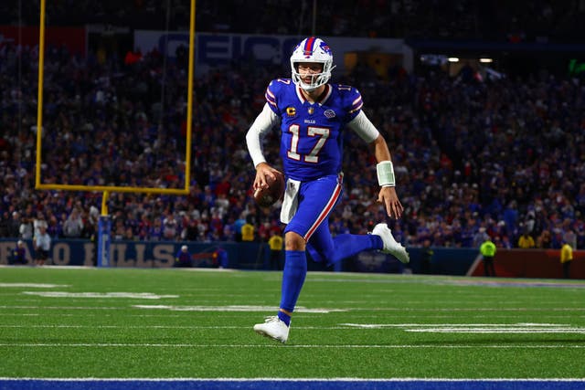 Buffalo Bills quarterback Josh Allen runs for a touchdown against the Baltimore Ravens (Jeffrey T Barnes/AP)