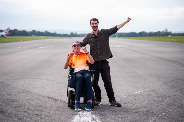 <p>Paul celebrating with his son David</p>