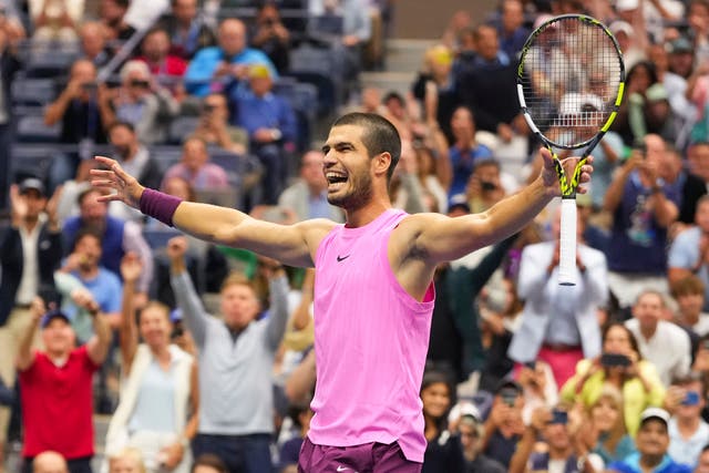 Carlos Alcaraz celebrates after defeating Jannik Sinner (Kirsty Wigglesworth/AP)